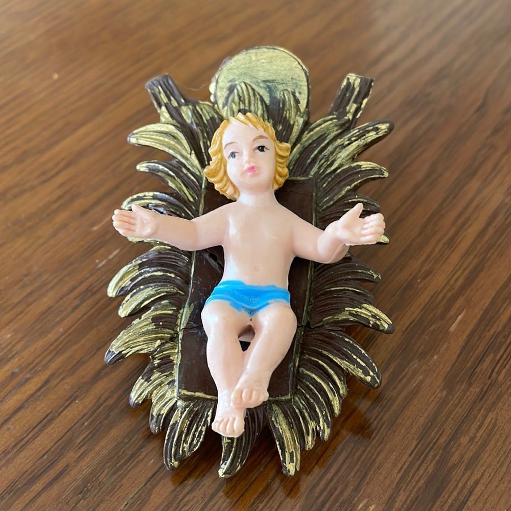 Vintage plastic baby Jesus in manger bed